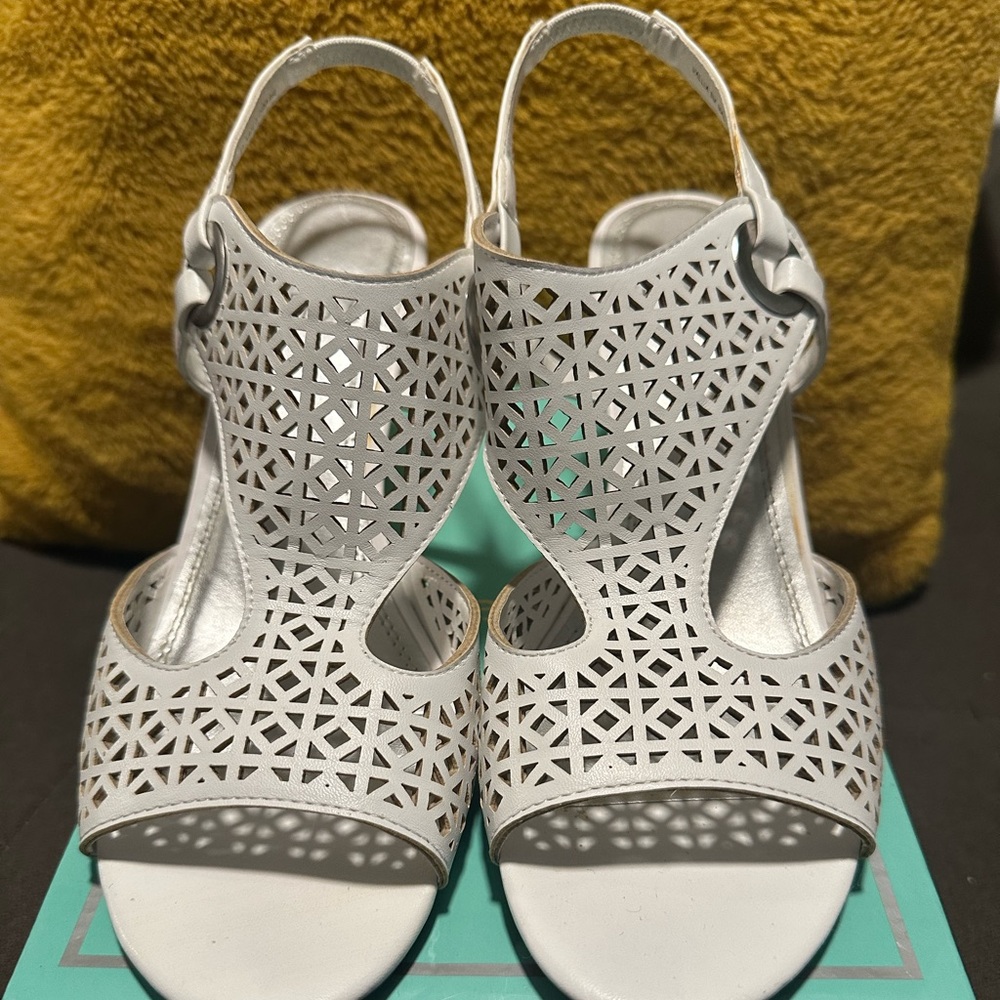 Women’s white wedge heels.